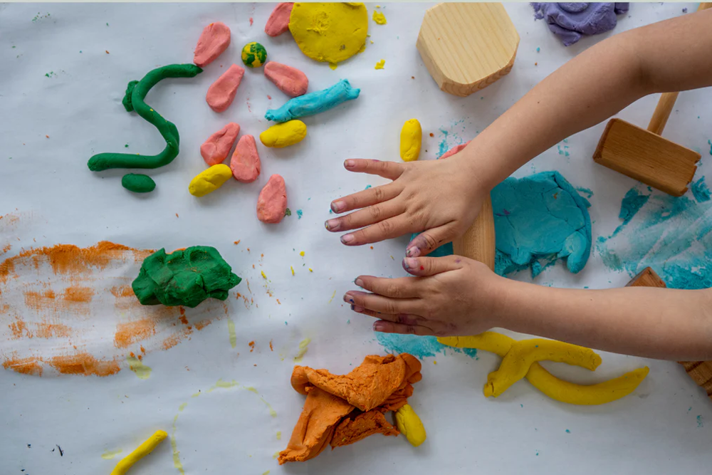 Solitary Play Matters: Unlocking Emotional and Cognitive Growth 21 Manipulating Play Dough or Clay
