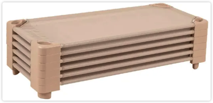 Beige low-frame classroom nap cots nested together for storage.