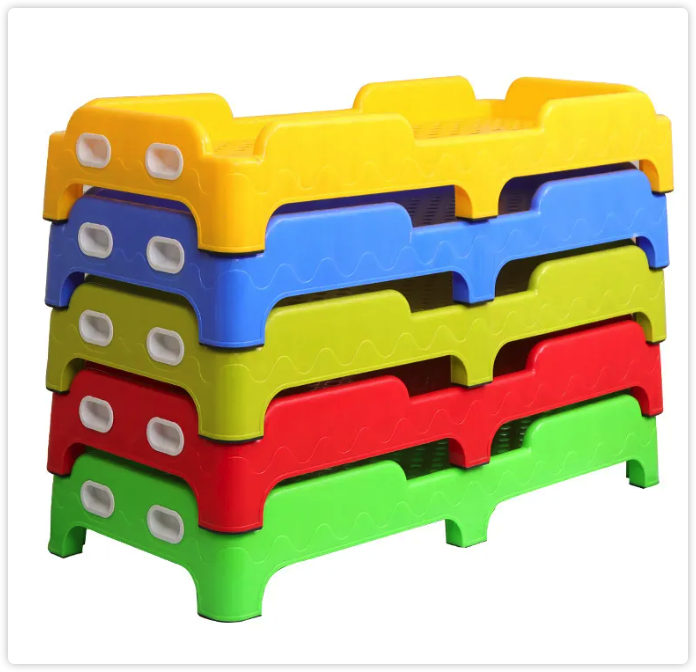 Multicolored nesting cot units stacked together, with side openings visible.