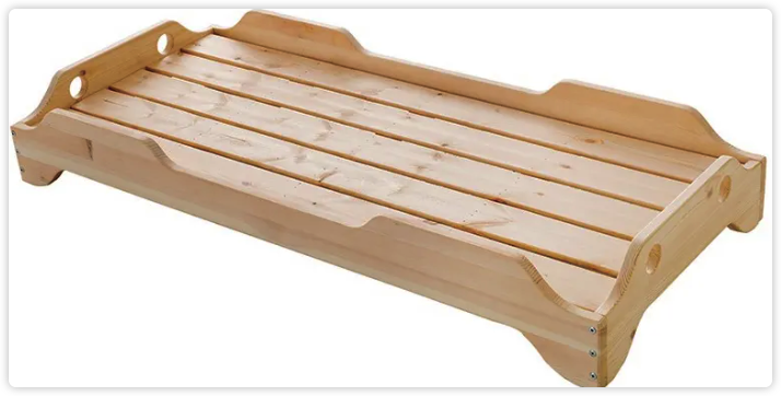 Wood-frame cot with a slatted sleeping base and raised side and end panels.
